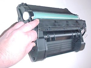 HP CF281X cartridge held open.
